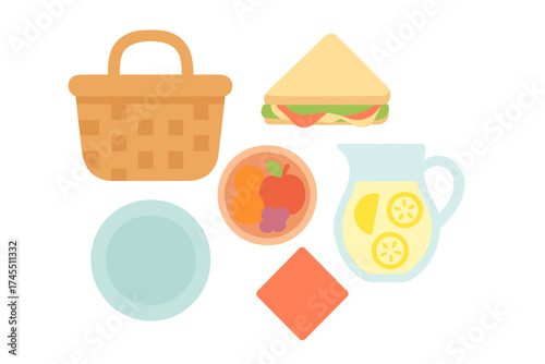Classic picnic elements assortment featuring a woven basket, fresh fruit, sandwich, and lemonade pitcher