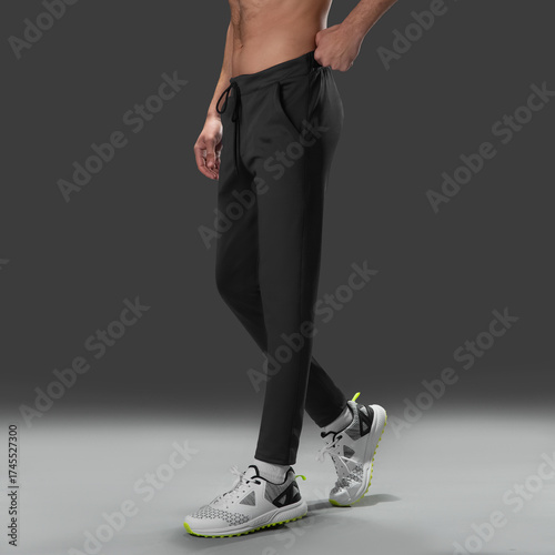 Fit young man wearing sportswear standing in studio