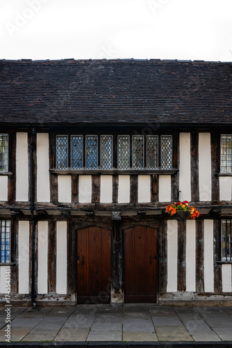 Fototapeta medieval building with doors and flowers in Stratford on Avon