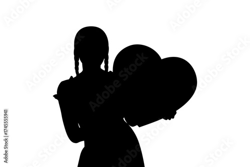 Silhouette of a young girl holding a large heart shaped balloon against a white background