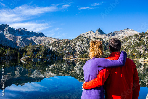 Wallpaper Mural Young hiker couple in autumn in Aiguestortes and Sant Maurici National Park, Spain Torontodigital.ca