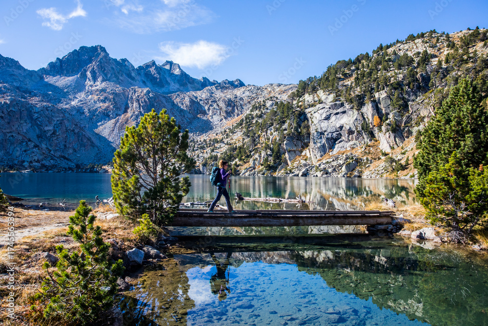 custom made wallpaper toronto digitalYoung hiker woman in autumn in Aiguestortes and Sant Maurici National Park, Spain