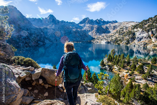 Wallpaper Mural Young hiker woman in autumn in Aiguestortes and Sant Maurici National Park, Spain Torontodigital.ca