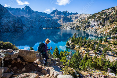 Wallpaper Mural Young hiker woman in autumn in Aiguestortes and Sant Maurici National Park, Spain Torontodigital.ca