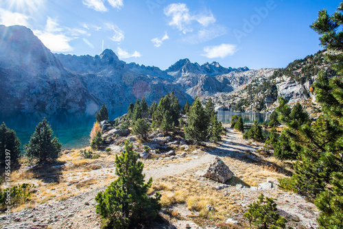 Wallpaper Mural Young hiker woman in autumn in Aiguestortes and Sant Maurici National Park, Spain Torontodigital.ca