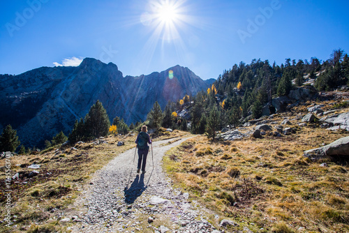 Wallpaper Mural Young hiker woman in autumn in Aiguestortes and Sant Maurici National Park, Spain Torontodigital.ca