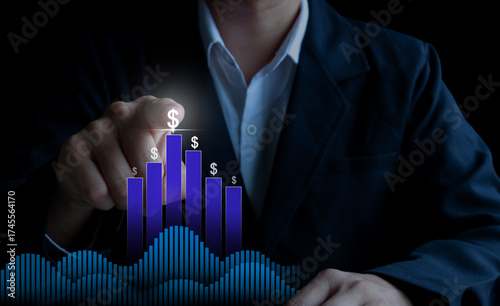 Businessman touching dollar sign bar graph growth concept for finance, investment, and financial success