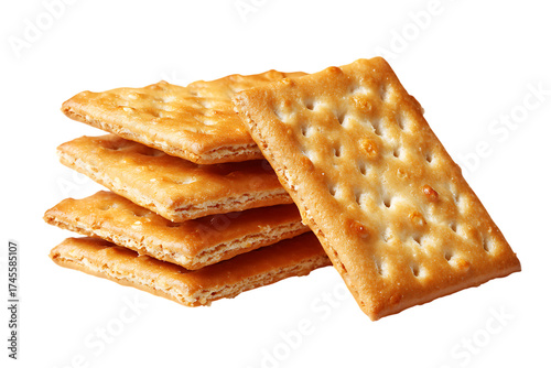 Close up of golden saltine crackers stacked on white background, showcasing their crispy texture and perforations