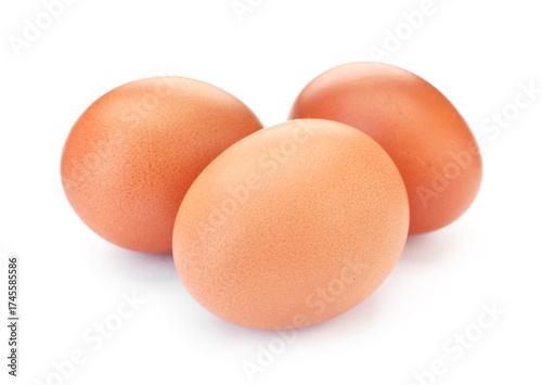 Three raw chicken eggs isolated on white