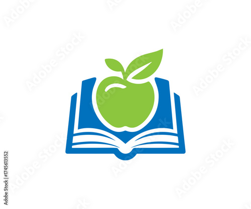 Green apple with leaves above an open blue book