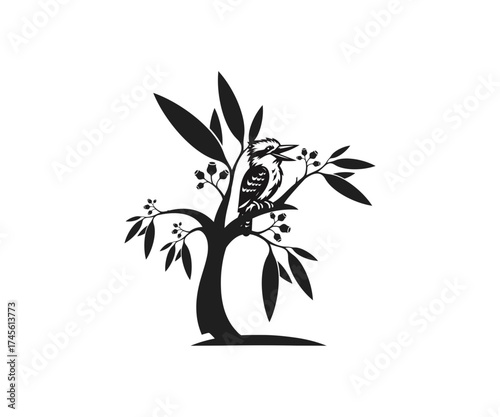 Silhouette of kookaburra bird on a leafy tree branch