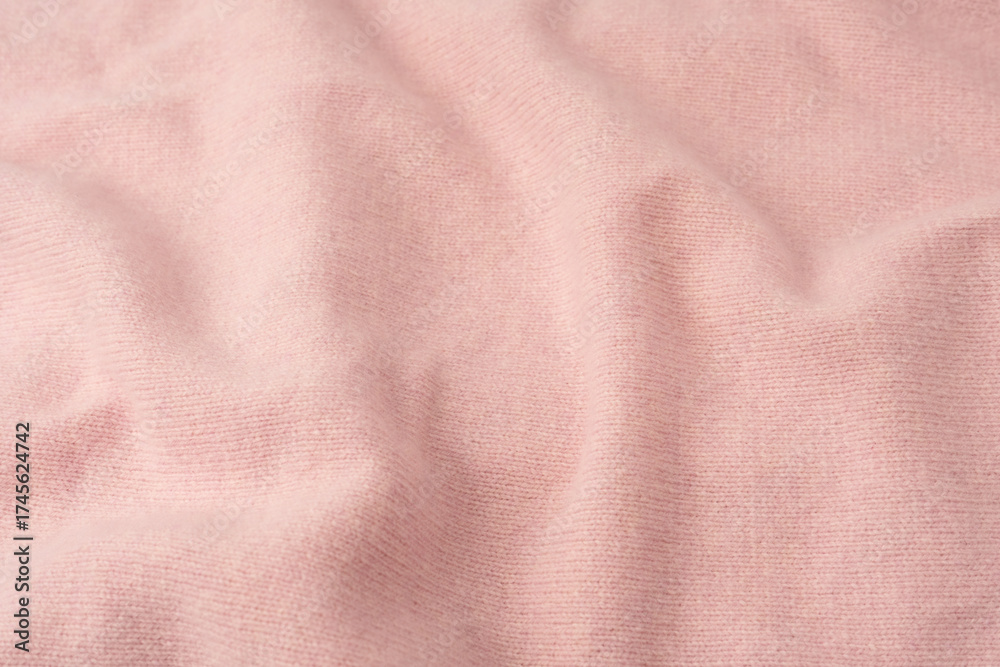 Fototapeta premium Soft pink cashmere sweater texture background.