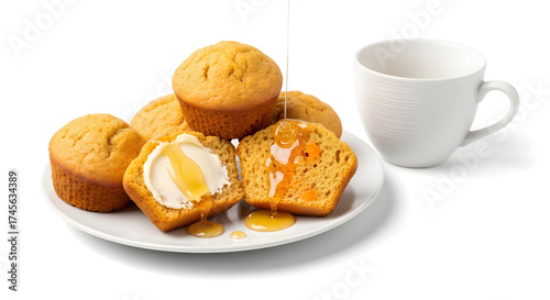 Yam muffins with butter spread and honey drizzle on white plate  