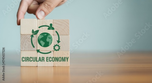 Circular Economy in Progress: A hand carefully places a block in a building a symbol of circular economy, representing sustainability and environmental responsibility. A vision for a greener future