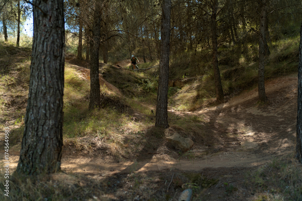 Naklejka premium young man riding a bicycle