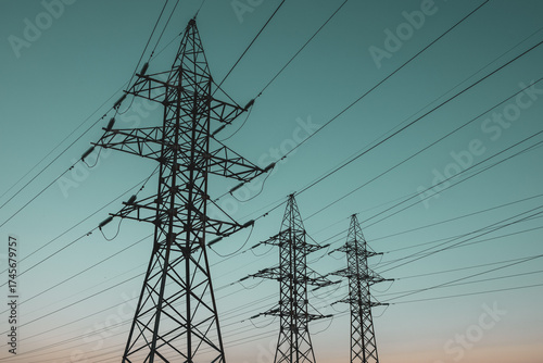 silhouette of high-voltage metal poles of power lines