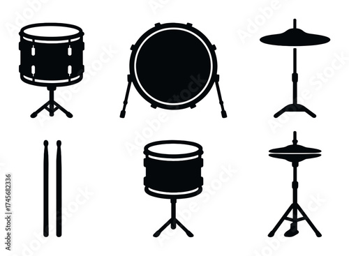 Silhouette of drum kit components with cymbals and sticks on dark background
