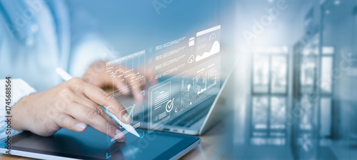 Fotografie Doctor using digital tablet and laptop with AI dashboard holographic checklist overlay, analyzing KPI, workflow process, and compliance data visualization in modern healthcare digital environment
