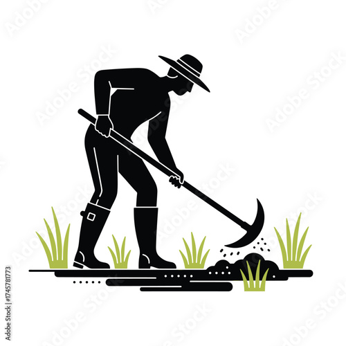 A farmer in a hat and boots, silhouetted while using a hoe to tend the grass