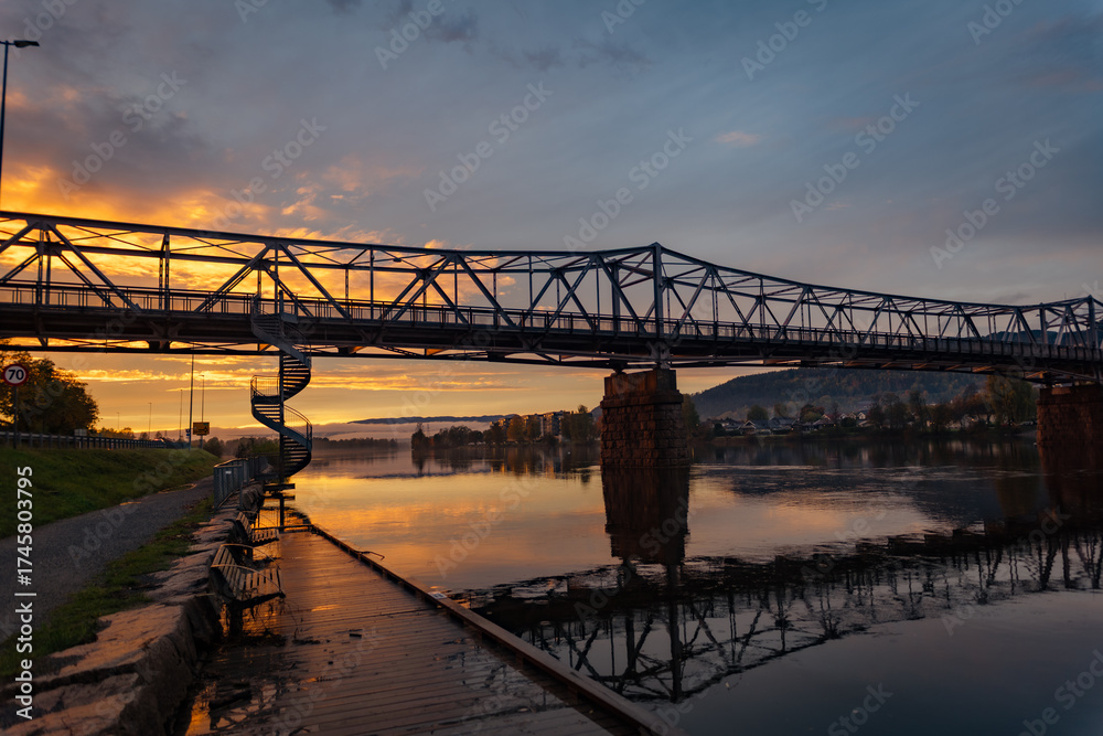 Fototapeta premium bridge over the river at sunset