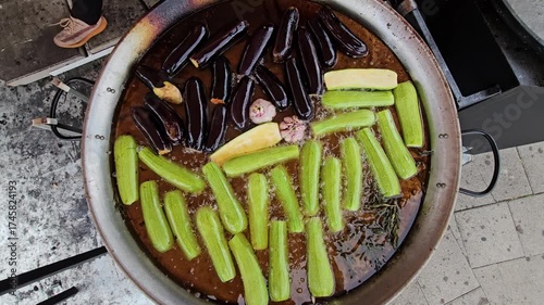 Eggplant and zucchini are fried with garlic and herbs in oil