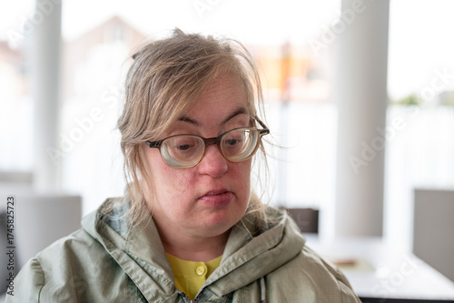 Portrait of a sad 43 yo woman with Down Syndrome, Tienen, Belgium