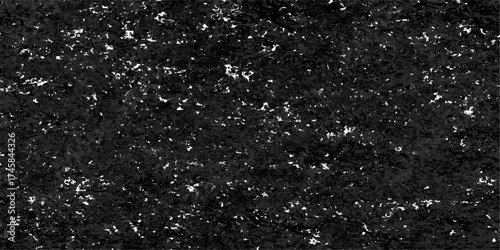 Close-up detail of abstract water drops on a dark black rough surface resembling asphalt texture