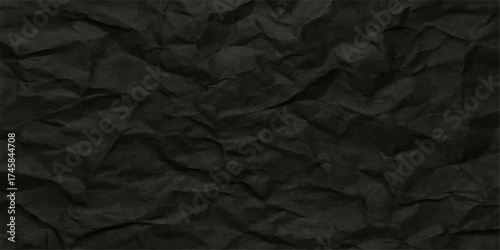 Black paper background with a crumpled and textured surface for a grunge design