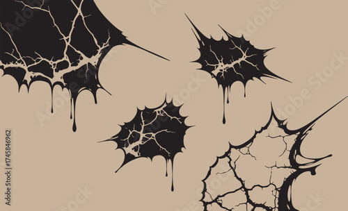 Abstract black ink splatters and drips on a textured beige background