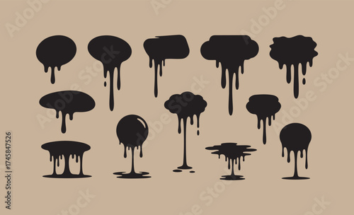 Collection of black ink splatters and drips on a textured background