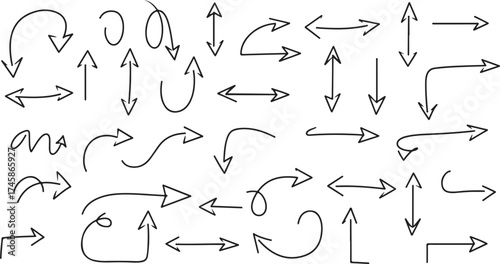 Collection of hand drawn black arrows pointing in various directions on a white background surface