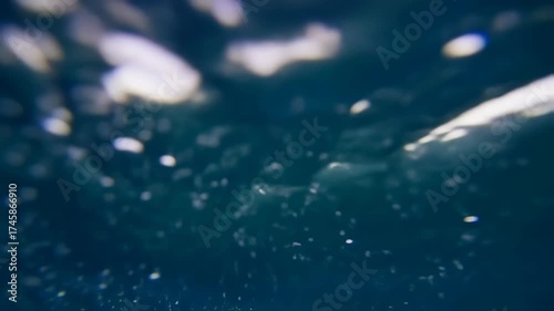 Underwater World - Bubbles and Light Dancing in the Deep Blue Ocean.