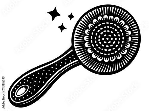 Facial cleansing brush with decorative handle and sparkling accents. This facial cleansing brush features intricate detailing and a comfortable grip, perfect for skincare routines.