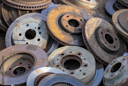 pile of vehicle roters brakes rusty wheels