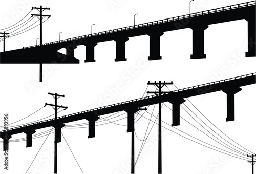 Silhouette of elevated bridge with power poles and cables, black and white infrastructure scene, electric utility lines, urban development concept