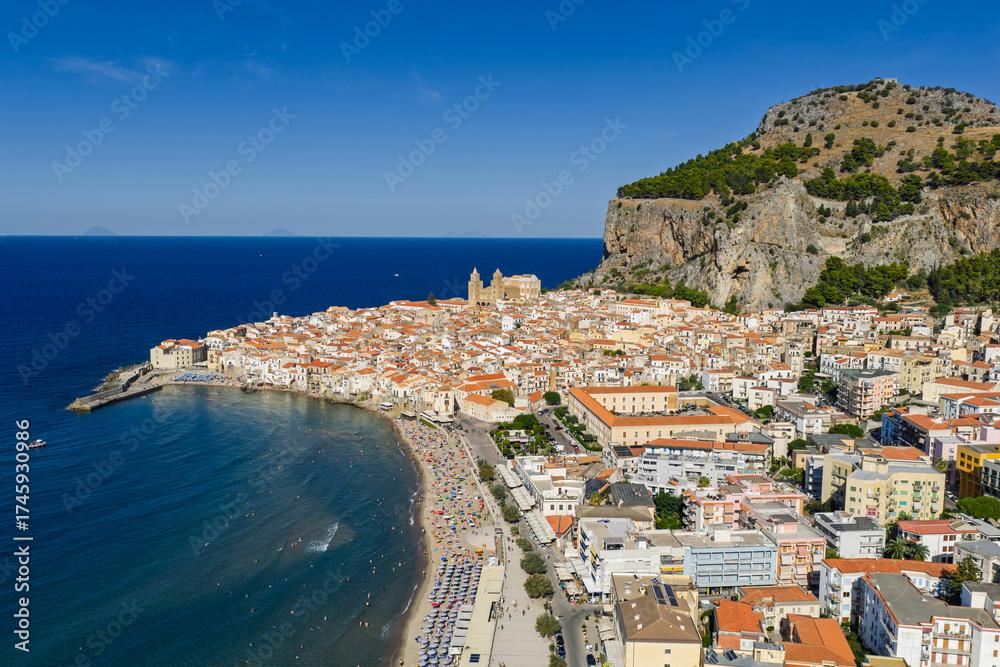 Fototapeta premium Aerial drone view of Cefalu historic medieval old town with cathedral beach and turquoise Tyrrhenian Sea in summer on northern coast of Sicily island southern Italy Europe Mediterranean destination