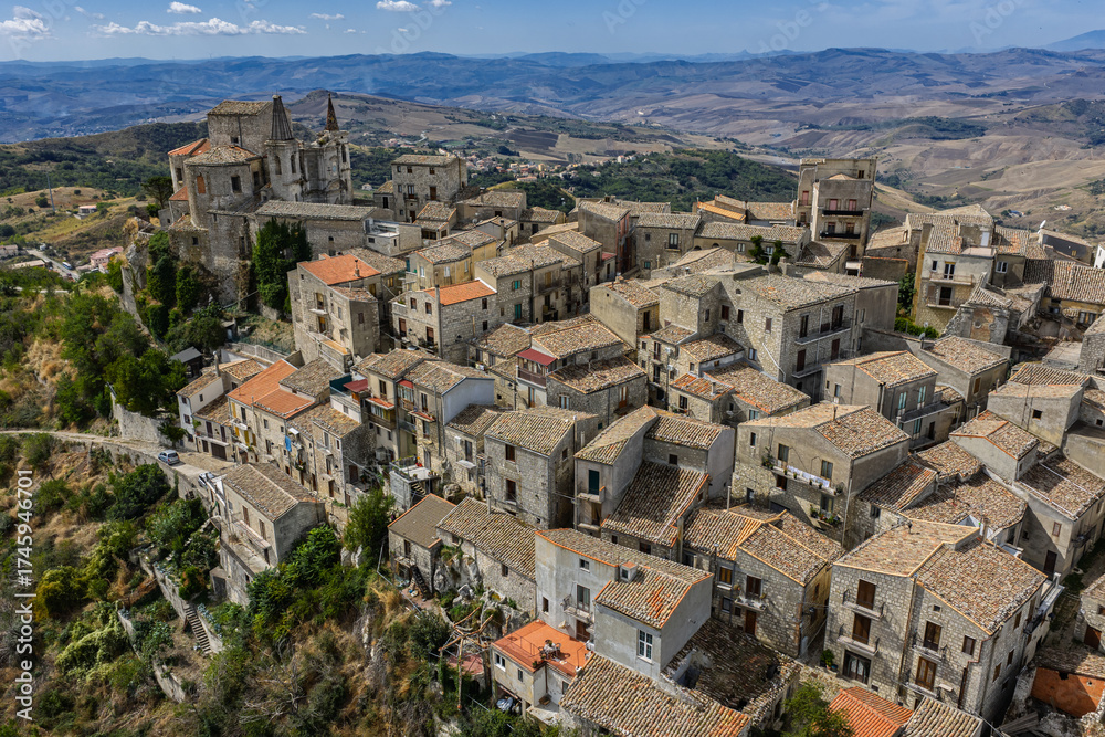 Fototapeta premium Aerial drone view of Petralia Soprana, a historic Sicilian mountain town with panoramic views of the Madonie Mountains,Petralia Soprana famous Church of Saint Mary of Loreto, Sicily, Italy