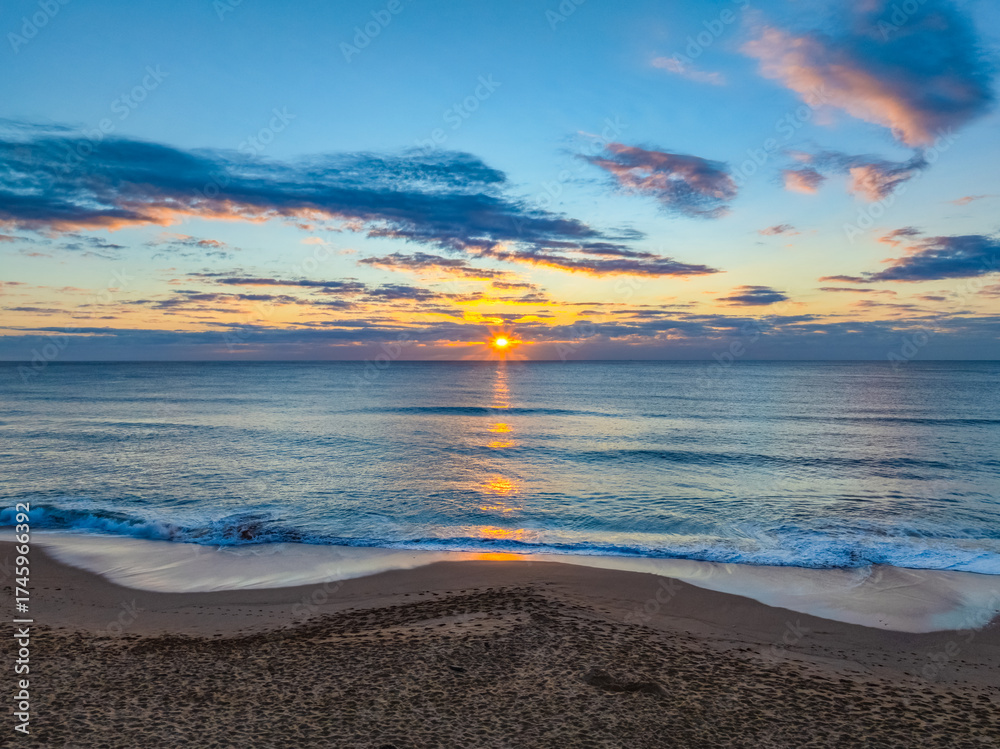 Fototapeta premium Sunrise Seascape Over Gentle Ocean Swells