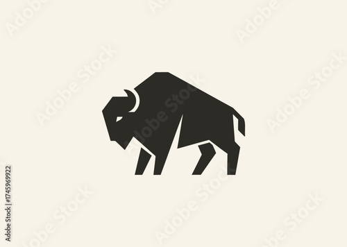 A simple geometric bison logo, symbolizing strength, resilience, and grounded power through clean angular lines