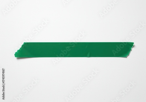 Free Download Green adhesive tape strip with torn edges on a white background. - GFXLoad