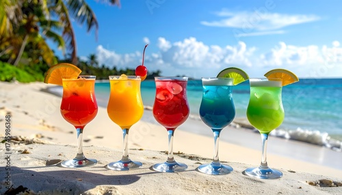 Fototapeta Naklejka Na Ścianę i Meble -  Vibrant tropical cocktails on a white sand beach with palm trees and turquoise water under bright sunny sky, refreshing summer vacation scene