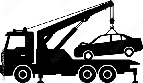 Silhouette of a tow truck lifting a broken down car with its crane
