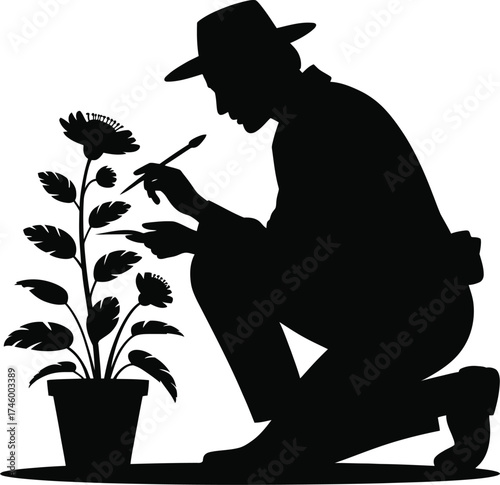 Silhouette of a gardener kneeling and caring for a potted flower plant