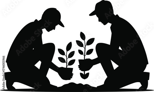 Two people planting new seedlings in a garden silhouette