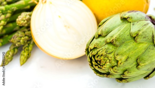Fresh asparagus, onion, and artichoke close-up
