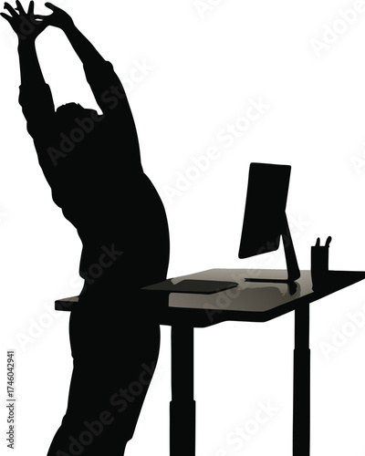 reflects the moment of a person standing and stretching at a desk