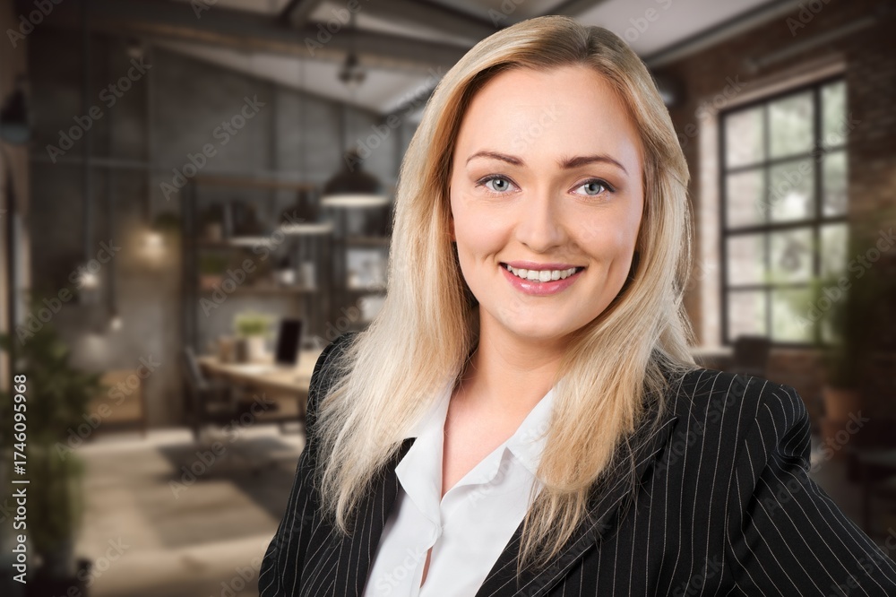 Fototapeta premium Confident beautiful business leader posing in office