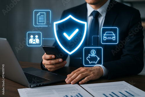 Businessman using smartphone for insurance security service with shield icon on virtual screen representing protection for family, money, car, and financial documents