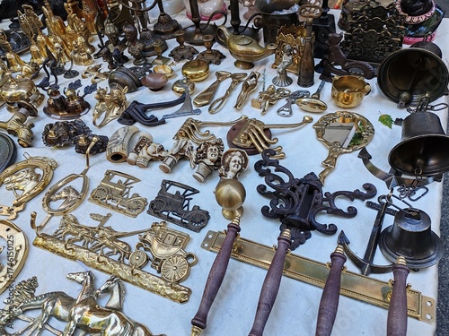 Rome, Italy - September 28, 2025, detail of a series of old and antique objects such as locks and various objects on the counter of a second-hand dealer in the large Porta Portese flea market.