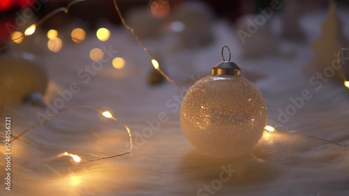 White christmas ball with light on wool for celebration christmas and new year.